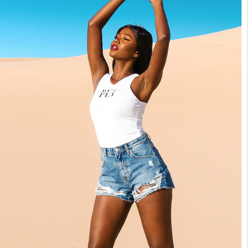 PRETTYLITTLETHING Mid Blue Wash Ripped Hem Denim Shorts